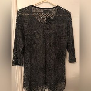 Brand new shirt by the brand Creation never worn and still has the tags on